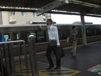 Man in train station in Kobe Japan July 2010