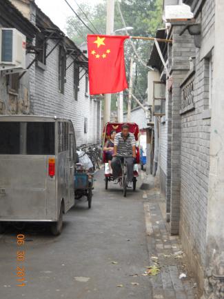 Pedicab traveling in a Beijing hutong.