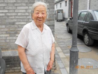 Elderly woman living in a Beijing hutong neighborhood.